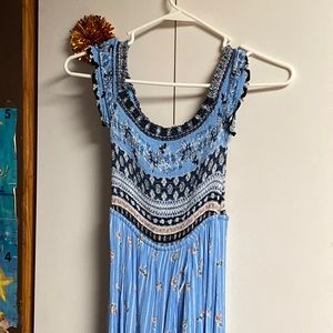 High low romper with a skirt overlay.